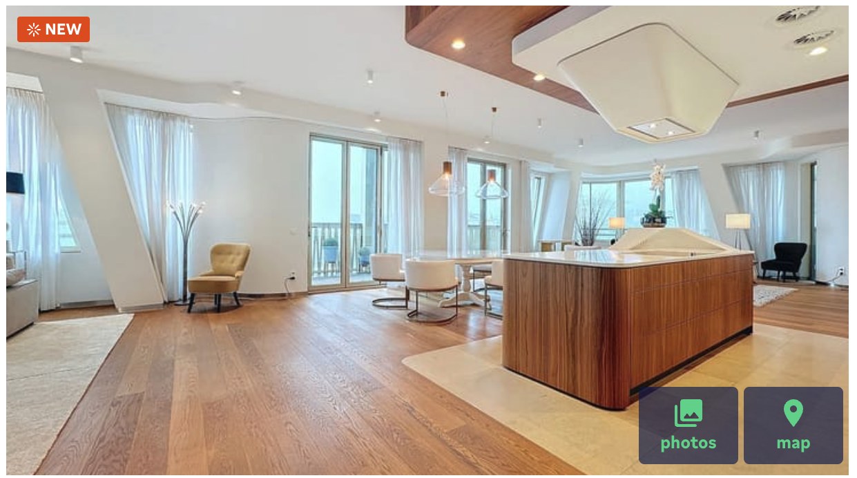Living and dining area with a walnut kitchen island